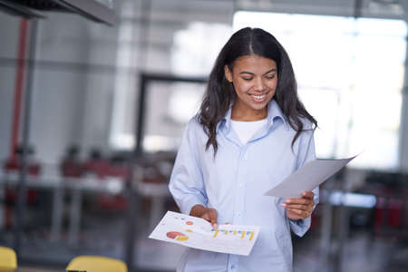 Happy woman preparing for meeting in conference roomの写真素材