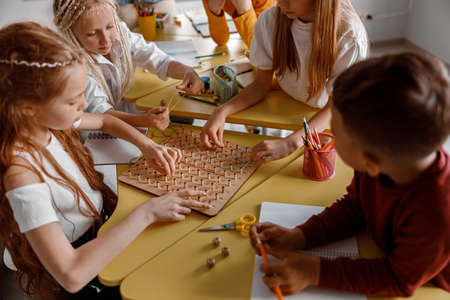 Girls and boys training analytical and creative skillsの写真素材