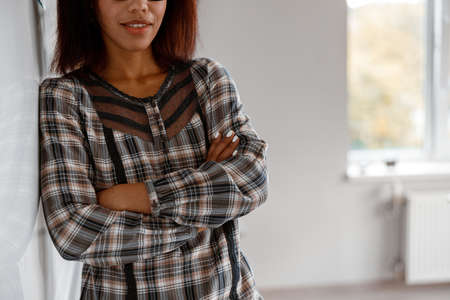 Happy Afro American woman standing in classroomの写真素材