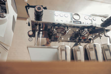 Professional modern coffee machine on counter in cafeteriaの写真素材