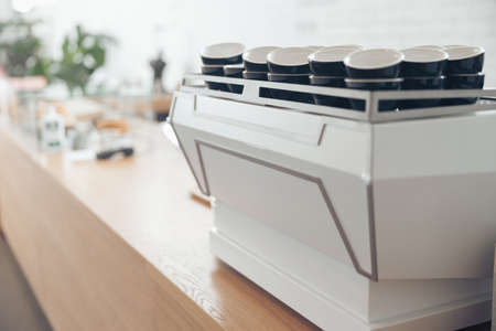 Collection of coffee cups on counter in cafeの写真素材