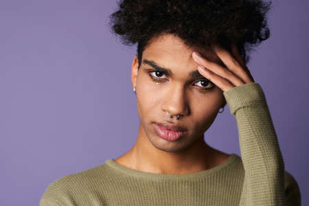 Portrait of african american man looking camera. Closeup face with sensual lips and eyesの写真素材