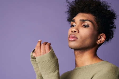 Close up portrait of latin american brunette male with afro hairstyle. Sensual young manの写真素材