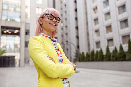 Hopeful female staring in distance from streetの写真素材