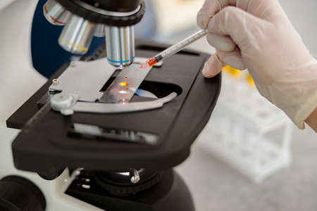 Laboratory assistant is conducting research in clinicの写真素材