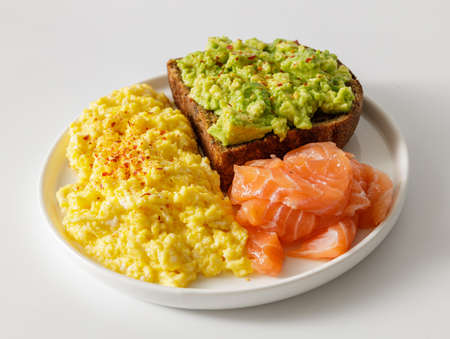 High-calorie and hearty food on white plateの写真素材