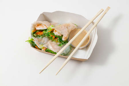Raw fish and rice in sushi on white background