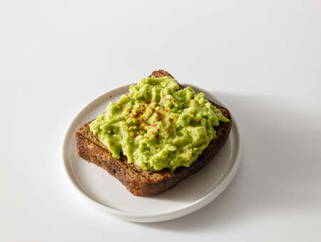 Avocado toast on whole grain sandwich breadの写真素材
