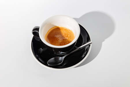 Empty used coffee cup against white backgroundの写真素材