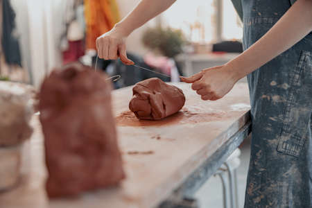 Diligent master molding clay product in ceramics workshopの写真素材