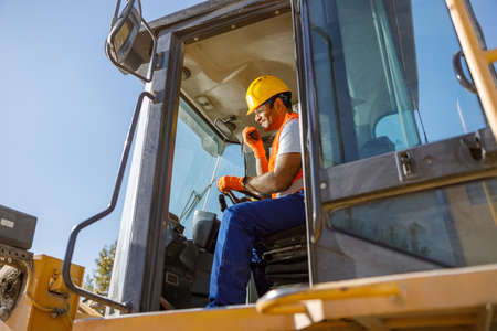Industrial worker on his job at construction plantの写真素材
