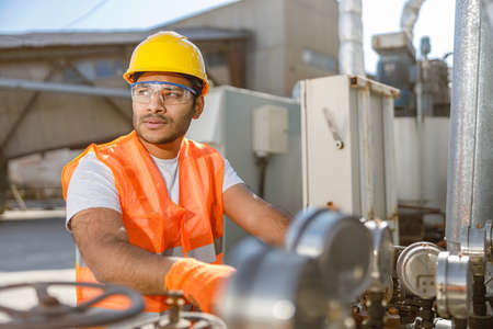 Industrial worker on his job at construction plant