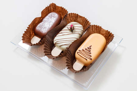 Ice cream sticks with chocolate and vanilaの写真素材