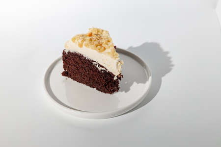 Sliced piece of cake on white background