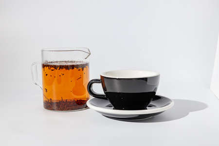 Black cup with sauce for drinking beverageの写真素材