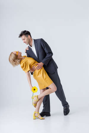 Beautiful couple in love demonstrating tango dance poseの写真素材