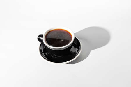 Top view of coffee in black cup with sauceの写真素材