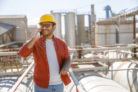 Photo of happy male multiethnic worker in plantの写真素材