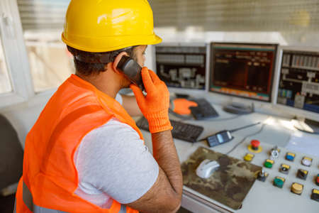Experienced operator concentrating at his work in plantの写真素材