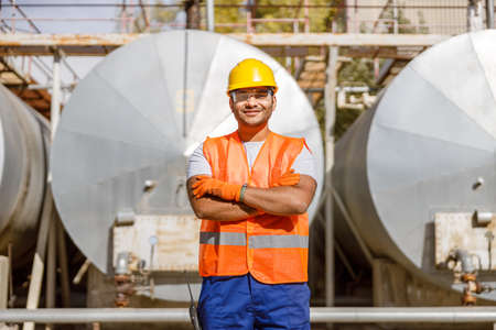 Photo of happy multiethnic worker in plantの写真素材