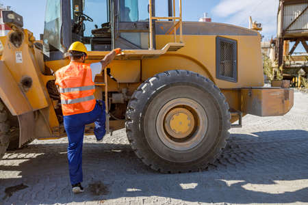 Experienced foreman with hard hat in factoryの写真素材