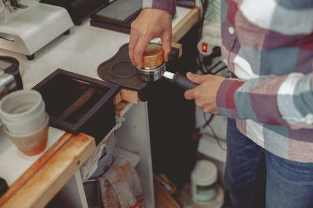 Process of preparing coffee tablet before inserting it into the coffee machineの写真素材