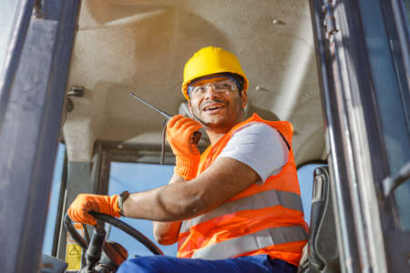 Worker in safety equipment working at heavy industry plantの写真素材