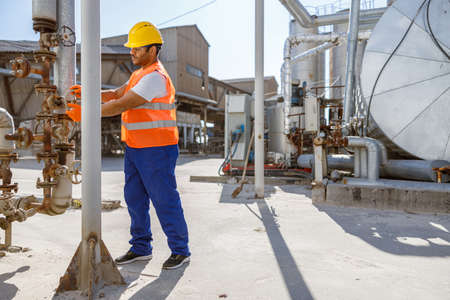 Industrial worker on his job on construction siteの写真素材
