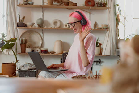 Business woman works at her pottery storeの写真素材