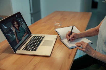 Senior woman working with laptop at homeの写真素材