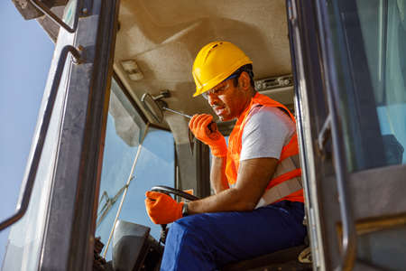 Experienced construction worker working hard at factoryの写真素材