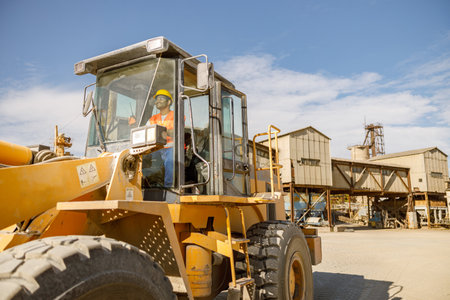 Manual worker driving cargo truck in plantの写真素材