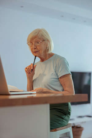 Photo of confident aged lady at homeの写真素材