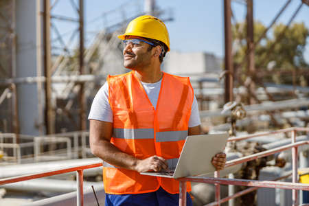 Photo of happy male multiethnic worker in plantの写真素材