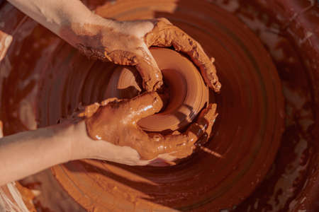 Photo of process of creating pottery by handsの写真素材