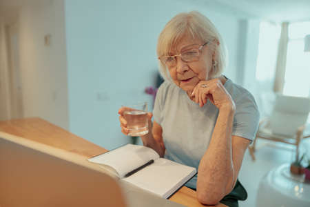 Photo of confident aged lady at homeの写真素材