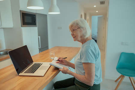Photo of confident aged lady at homeの写真素材