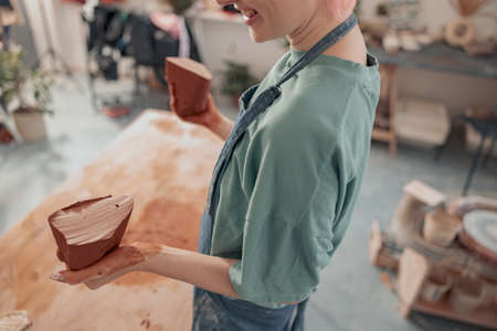 Female master ceramist working at her studioの写真素材