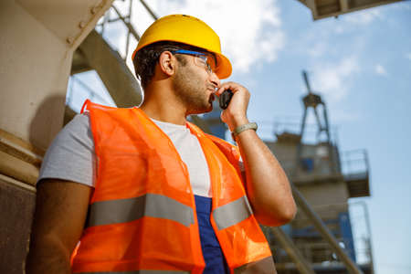 Heavy industrial engineer with walkie-talkie at plantの写真素材
