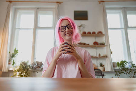 Positive female artisan having ceramics in workshopの写真素材