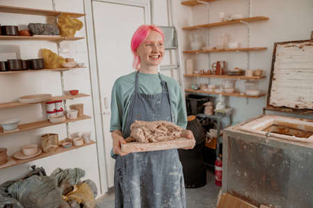 Female master ceramist working at her studioの写真素材