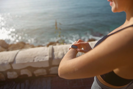 Fit young woman exercising near sea beachの写真素材