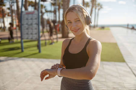 Young woman going in for sport on summer dayの写真素材
