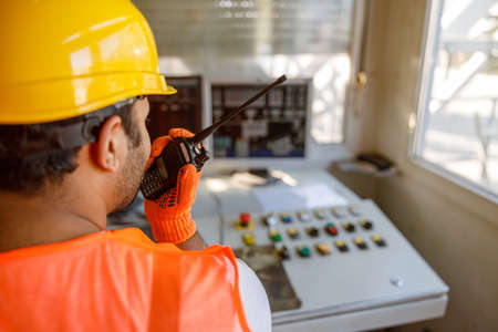Experienced foreman concentrating at his work in plantの写真素材