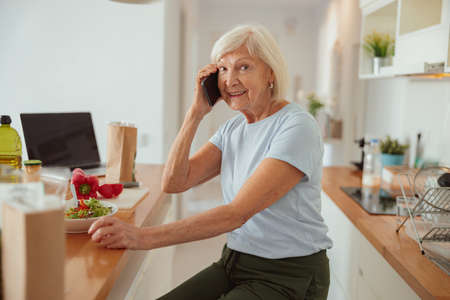 Photo of confident aged lady at homeの写真素材