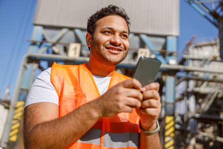 Photo of happy male multiethnic worker in plantの写真素材