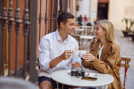Young happy couple resting after walk outsideの写真素材