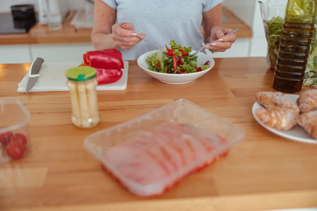 Elderly female leading healthy lifestyle at homeの写真素材