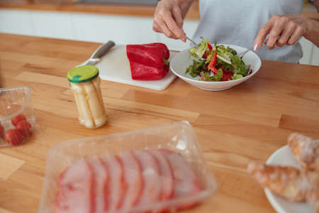 Elderly female leading healthy lifestyle at homeの写真素材