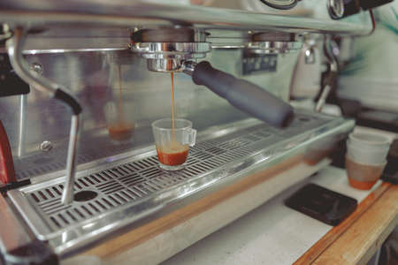 Process of preparing cappuccino in coffee machineの写真素材